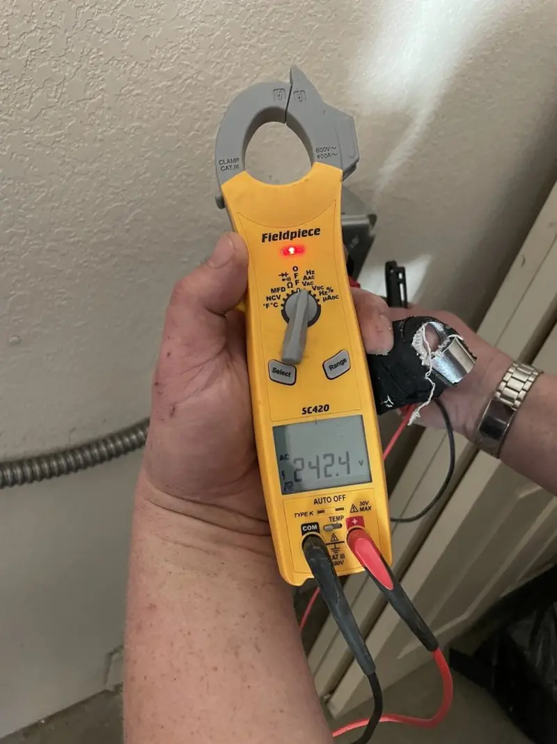 Voltage testing with clamp meter during Circuit Breaker Repair in Haskell
